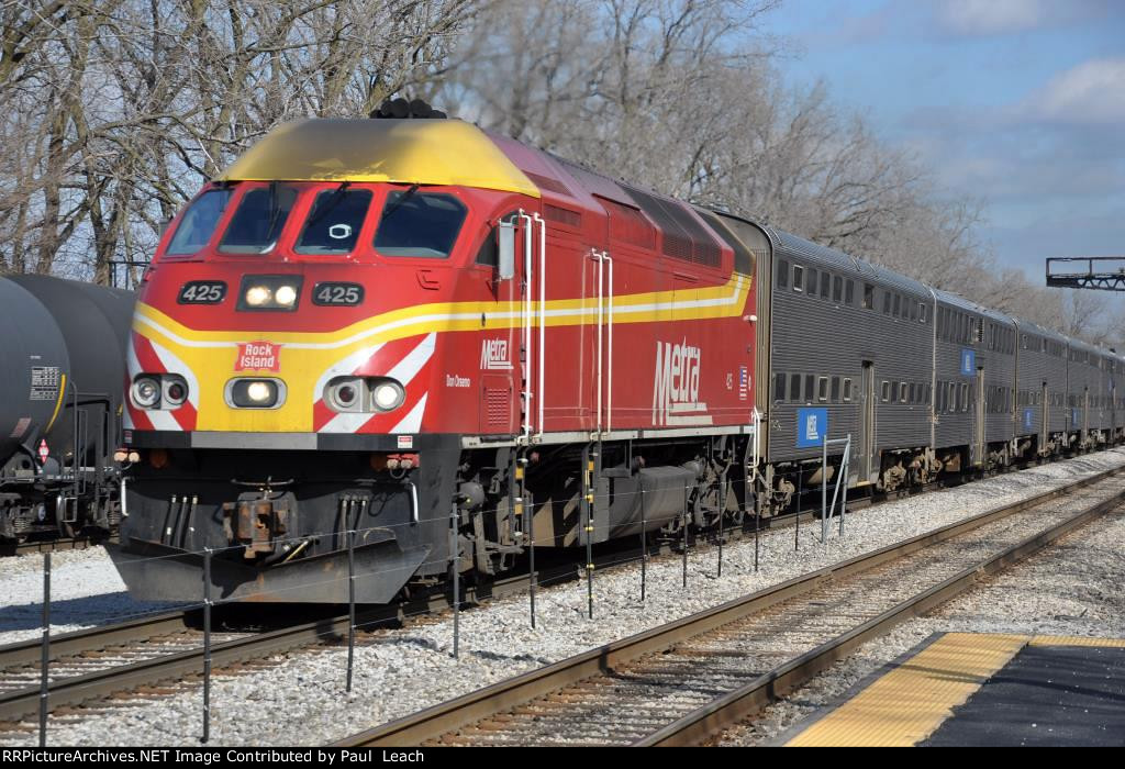 Rock Island heritage unit rolls an outbound commuter into the station